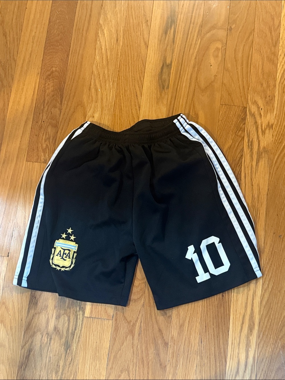 Kids Black Soccer Shorts with White Side Stripes and Number 10